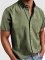 Detailed view of a men's olive green short sleeve button-down shirt with a pocket. - S / Tops / Army Green