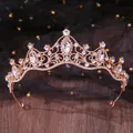 Detailed shot of an elegant rose gold bridal crown with shimmering clear rhinestones - Royal Hollow Style (077) / Gold