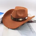 Detail of brown western cowboy hat with bull head emblem and decorative band. - Beaded Cowboy Style / Cattle Yellow