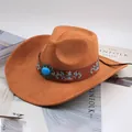 Close-up of a brown suede western cowboy hat with an embroidered decorative band - Embroidered Gem Decor / Cattle Yellow