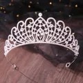 Detailed shot of a silver bridal rhinestone tiara with elegant curved patterns and clear crystals. - Lace Rhinestone Style (11) / Silver