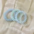 Ensemble élégant de quatre élastiques à cheveux en spirale bleu et transparent à haute élasticité. - Style 13 / 4件套 OPP袋装 / 亮浅蓝透明色