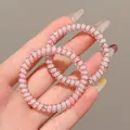 Lot de deux élastiques à cheveux spirales roses à fleurs avec design fil de téléphone - 5#细款 / 约 4.5cm 2件装 / Imprimé Rose Clair