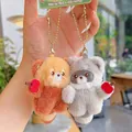 Pair of cute magnetic plush animal keychains featuring red panda and raccoon with apple - Mini Animal Magnetic Pair / Red Panda