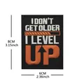 8x6cm I Level Up slogan embroidered tactical patch for gym backpacks and outdoor gear - V01789-1 I Don't Get Older (black Cloth Orange Text)