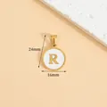 Gold plated stainless steel round pendant featuring white inlay and letter R, size 16x24mm - Letter R / Height 16 * Thick 1.4mm