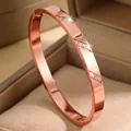 Elegant 18K rose gold plated titanium steel bangle featuring slanted paved zircon stones - Diagonal Stripe Rhinestone Style (35-D-3)