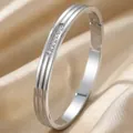 Elegant silver titanium steel bangle with channel-set sparkling white crystals - Pave Diagonal Stripe Style (43甲-E-10)