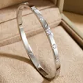Elegant silver titanium steel bangle bracelet with square-cut clear zircons in box - Dotted Rhinestone Style (30-B-10)
