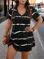 Plus size black V-neck short sleeve dress with white horizontal stripes in outdoor street setting. - 1XL / Tops / Black