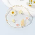 Sottobicchiere in resina trasparente con veri fiori essiccati e dettagli in foglia oro - Fiore Secco Bianco