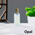 Elegante Parfüm-Sprühflasche aus Opalstein mit luxuriöser goldener Metalldüse. - Opal