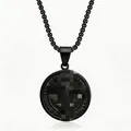 Detailed macro view of black stainless steel Saint Benedict medal pendant with Latin script - Necklace And Pendant Set / Black