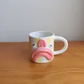 Creative blobfish face ceramic coffee mug with yellow stripes on a wooden desk surface - Yellow Stripes (Double-Sided Expression)