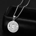 Silver stainless steel Saint Benedict medal necklace on black jewelry display case - Necklace And Pendant Set / Silver