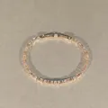 Détail d'un bracelet étincelant en or rose avec des cristaux géométriques ambrés - Style Carré Champagne Entièrement Sertis de Strass / Or