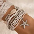 Elegante set de 7 pulseras bohemias con cuentas, estrella de mar y conchas marinas - Plateado
