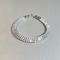 Bracelet tennis élégant à trois rangées de cristaux clairs, finition argentée femme. - Style Triple Rangée de Strass Blancs / Argent