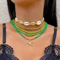 Detalle de juego de collares de cuentas bohemias con colgante de estrella de mar y gargantilla. - Collar Verde