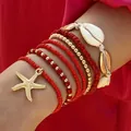 Ensemble de bracelets bohèmes en perles rouges avec une breloque étoile de mer dorée - Bracelet de Cheville/Bracelet / Lot de 7 / Rouge