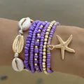 Bohemian meerlaagse paarse kralen armband set met zeester en schelp bedeltjes - Enkelbandje/Armband / Set van 7 / Paars