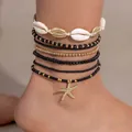 Boheemse meerlaagse enkelbandjes set met schelpen, kralen en gouden zeester hanger - Enkelbandje / Set van 7 / Zwart