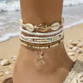 Handgemaakte Boheemse kralen enkelbandjes set met gouden zeester bedeltje en schelpen - Enkelbandje / Set van 7 / Wit