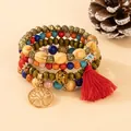 Detailed view of Bohemian multi-layer beaded bracelet with tree of life charm - Red