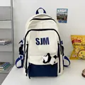 Mochila escolar grande en crema y azul marino con estampado SJM y colgante de panda - Azul / Sin colgante