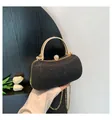 Elegant black glitter evening clutch bag featuring a gold handle and chain strap - Black