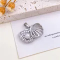 Silver-toned shell-shaped pendant featuring an opening design with a pearl and crystals - Shell Pearl Pendant (XL10) / Silver