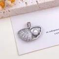 Exquisite silver seashell pendant with a radiant pearl and sparkling CZ stones. - Shell Pearl Pendant (XL11) / Silver