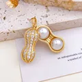 Unique opening peanut pendant with white pearls and sparkling pavé stones in gold. - Peanut Pearl Pendant (XL74) / Gold