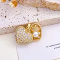 Gold heart-shaped pendant featuring pavé cubic zirconia and a lustrous white pearl accent. - Heart Pearl Pendant (XL1867) / Gold