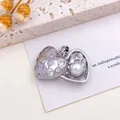 Elegant silver-colored heart locket pendant with pearl and sparkling stones detail - Heart Pearl Pendant (XL2580) / Silver
