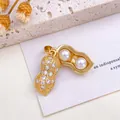 Elegant gold peanut pendant with two white pearls and sparkling cubic zirconia stones - Small Peanut Pearl Pendant (XL2728) / Gold