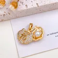 Exquisite golden peanut pendant featuring pavé crystals and a pearl on a white background - Longevity Lock Pearl Pendant (XL2815) / Gold