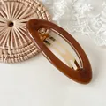 Elegante gelei bruine ovale haarclip voor verfijnde dameskapsels en haarstyling accessoires - Gelei Houtskool