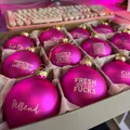 Set of funny pink Christmas baubles with humorous profane text slogans in box - Pink 12pcs Set