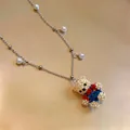 Detailed view of a cute beaded bear pendant necklace with elegant pearl accents - Necklace / Multicolor