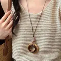 Handmade bohemian retro long necklace featuring a round wooden pendant and woven straw ring - Double Ring Wood Braided Style (35#)