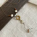 Vintage ethnic style necklace featuring wooden beads and shell-shaped pendants on brown cord - Wood Ring Irregular Pendant Style (11#)