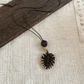 Vintage ethnic style necklace featuring a hollow leaf pendant and rustic wooden beads. - Hollow Leaf Pumpkin Bead Style (33#)