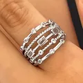 Close-up of a silver multi-layer braided ring with geometric cubic zirconia. - Multilayer Hollow Braided Style (K-102) / White Gold Color (K-102)