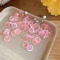 Pink shell disc and pearl tassel earrings on a decorative tray, SKU variant image. - 925 Silver Needle / Pink Shell Dangle