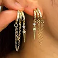 Close-up detail of stylish gold hoop earrings with zircon fringe and spike charms for women - Style 12 (6447)