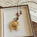 Detailed view of a woven straw hat pendant necklace with beads on a dark leather cord. - Woven Straw Hat Style (3 Necklace-Coffee-White)