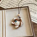 Detailed close-up of a handmade brown and white crochet flower pendant necklace - Crochet Woven Flower Style (4 Necklace-Coffee-White)