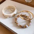 Vintage cream marble resin bangle with gold shell accents and beaded bracelet set - Shell Relief Marble Pattern Bangle Set (2) / Three-Piece Set / Gold-Ivory White