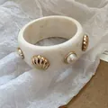 Vintage ivory resin bangle bracelet featuring golden shell and pearl stud accents - Thickened Shell Artificial Pearl Bangle (14) / Off White
